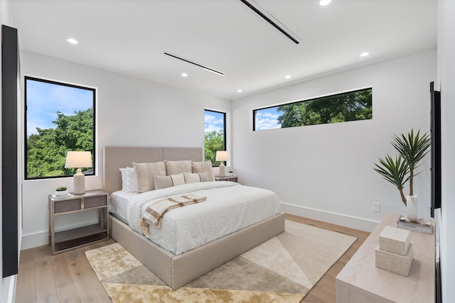 bedroom with light wood-type flooring