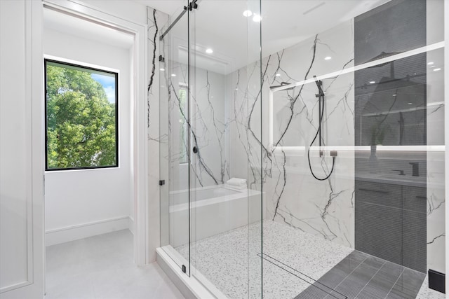 bathroom featuring a shower with door