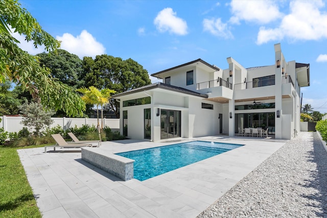 view of pool with a patio area and ceiling fan