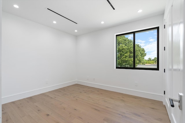 unfurnished room featuring light wood-type flooring