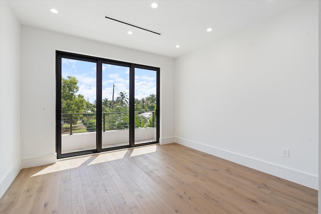 spare room featuring light hardwood / wood-style flooring