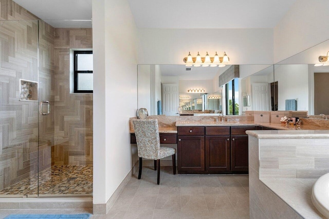 bathroom with tile patterned flooring, vanity, and separate shower and tub