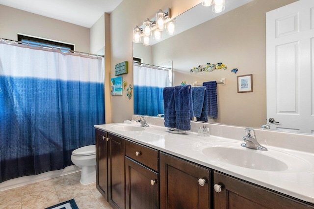 full bathroom with tile patterned flooring, vanity, toilet, and shower / bath combo with shower curtain