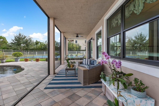 exterior space featuring ceiling fan