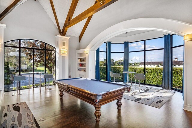 rec room with hardwood / wood-style floors, high vaulted ceiling, beam ceiling, and pool table