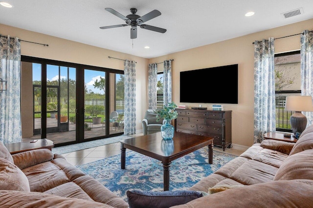 tiled living room with ceiling fan