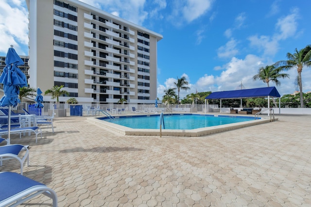 view of swimming pool with a patio