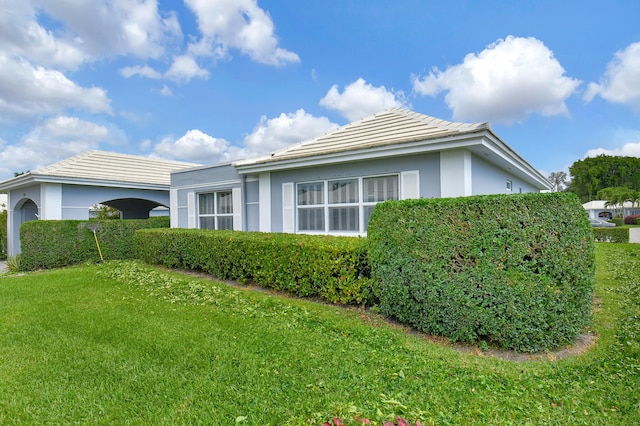 view of home's exterior with a yard