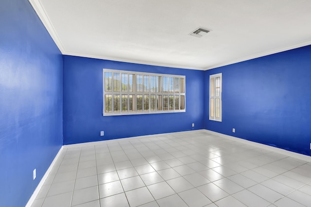 tiled spare room with crown molding