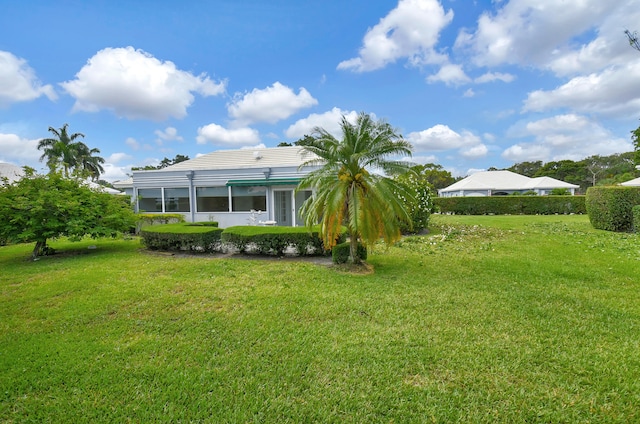 view of yard with a sunroom