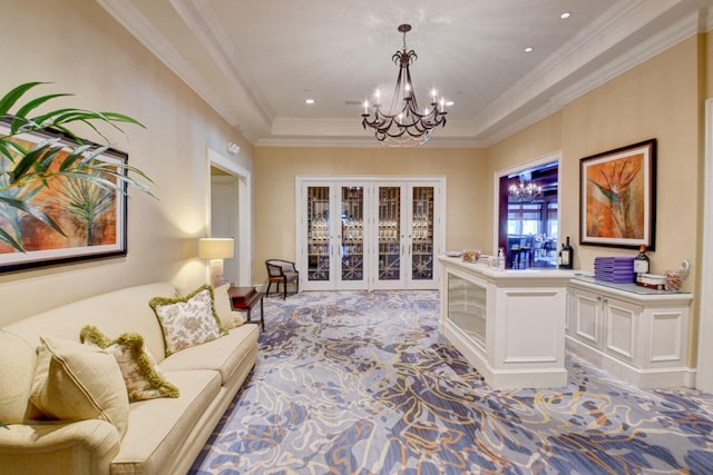 living room with a chandelier, ornamental molding, light carpet, and a tray ceiling