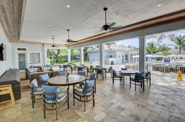 dining room with ceiling fan and light tile flooring