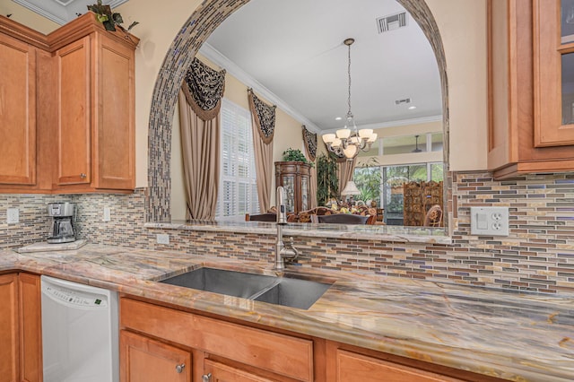 kitchen featuring sink, backsplash, white dishwasher, a chandelier, and ornamental molding