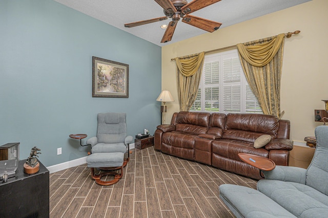 living room with ceiling fan, a textured ceiling, and hardwood / wood-style flooring