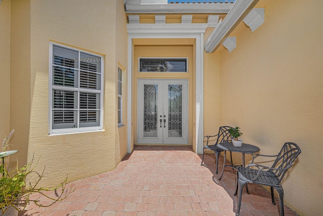 entrance to property featuring french doors