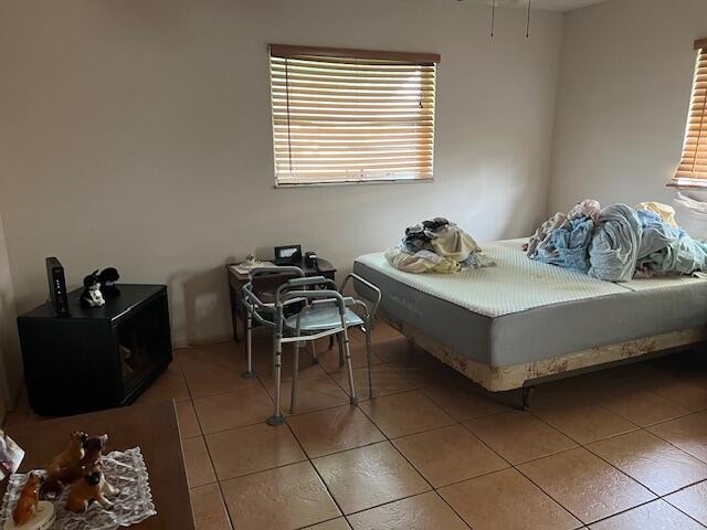 bedroom with tile floors