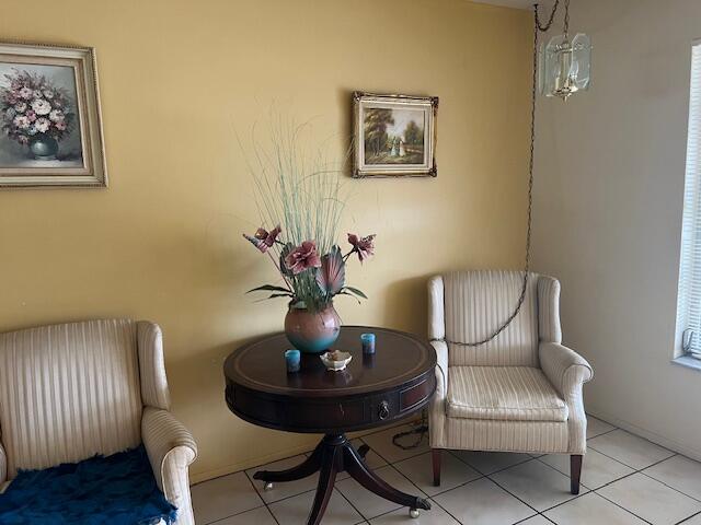 sitting room with tile flooring