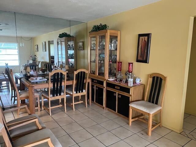 dining area featuring tile flooring