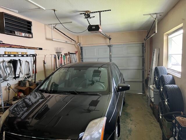 garage featuring a garage door opener