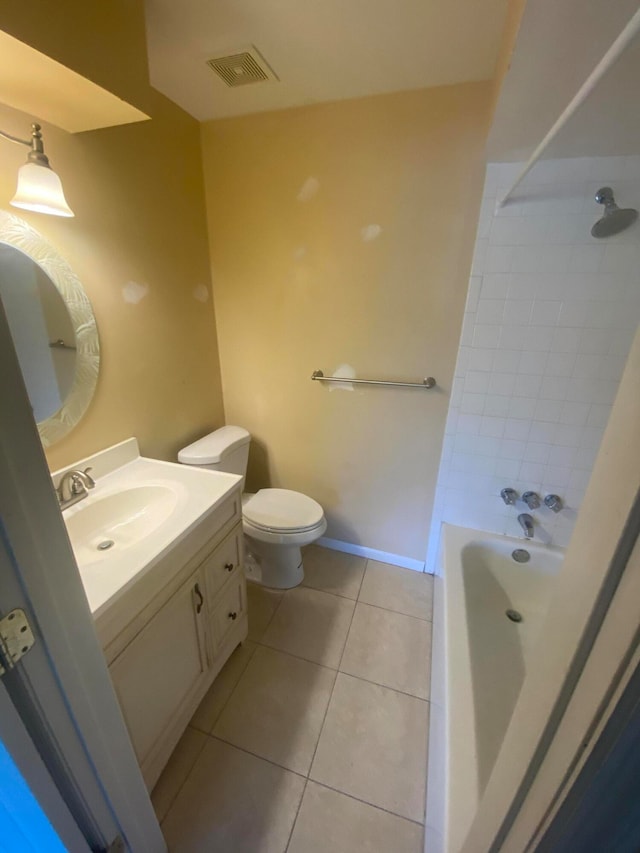 bathroom featuring tile patterned floors, vanity, and toilet