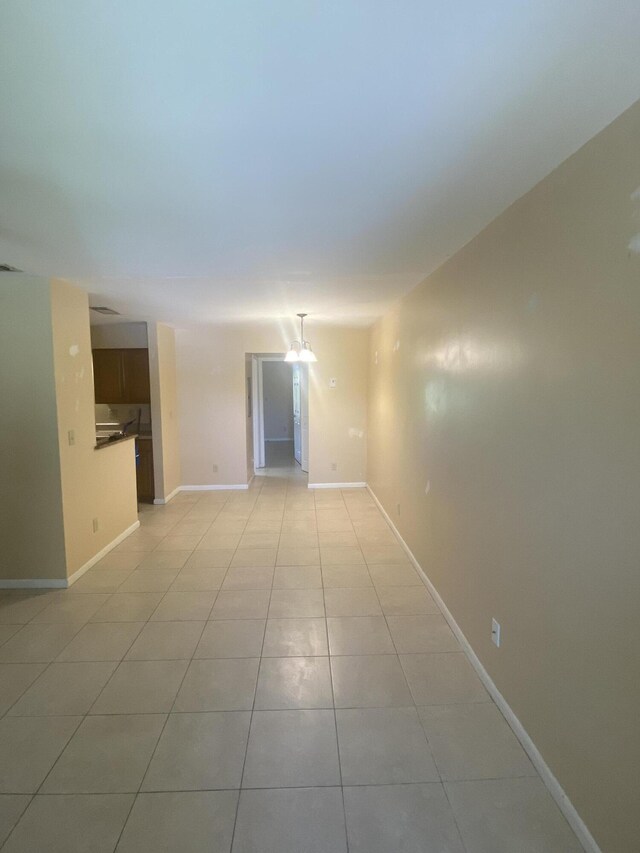 spare room featuring light tile patterned floors