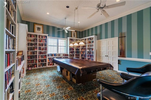 game room with ornamental molding, carpet, a ceiling fan, and wallpapered walls