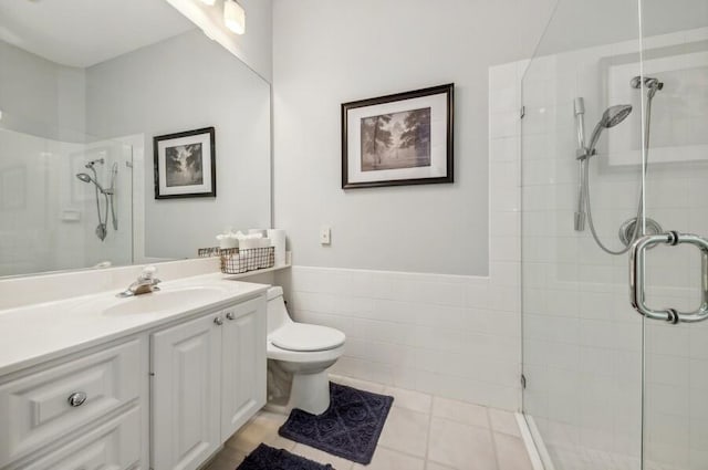 bathroom featuring walk in shower, toilet, tile floors, and vanity