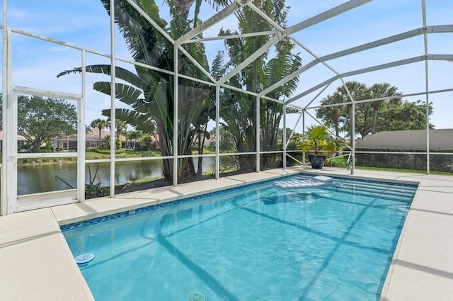 view of swimming pool featuring glass enclosure