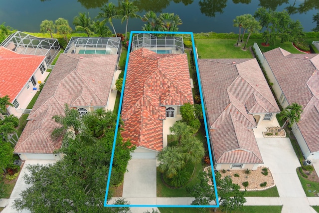 birds eye view of property featuring a water view