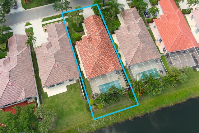 birds eye view of property featuring a water view