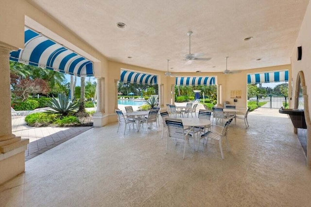 view of terrace featuring ceiling fan