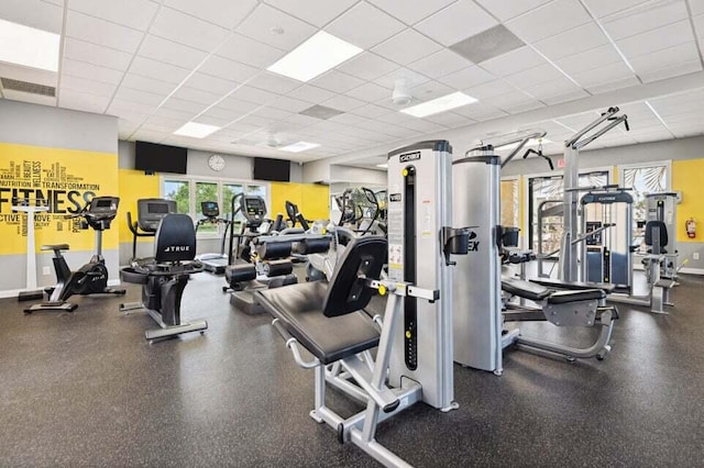 exercise room featuring a drop ceiling