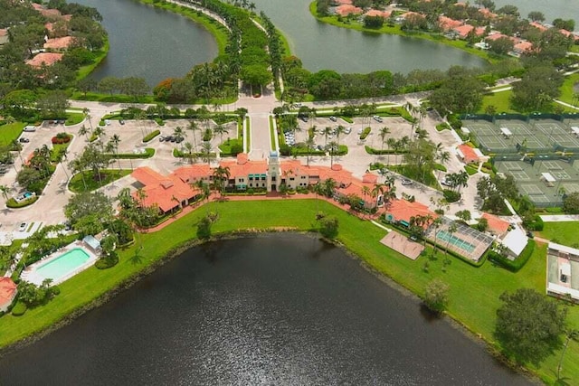 birds eye view of property with a water view