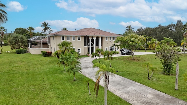 back of property featuring a lawn