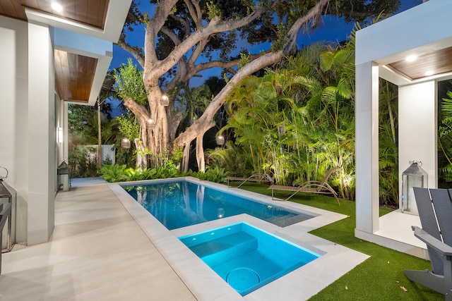 view of swimming pool with an in ground hot tub and a patio