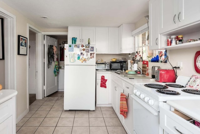 kitchen with white cabinets, white appliances, and light tile flooring