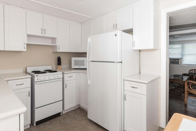 kitchen with white appliances and white cabinetry