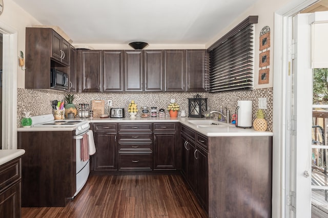 kitchen with dark brown cabinets, electric stove, sink, dark hardwood / wood-style flooring, and black microwave