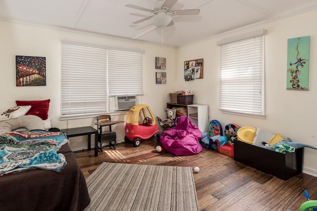 bedroom featuring hardwood / wood-style floors, ceiling fan, and ornamental molding