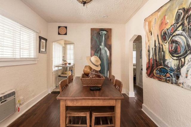 interior space featuring dark hardwood / wood-style floors and a textured ceiling