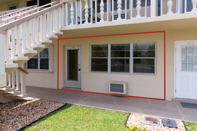 property entrance with a balcony