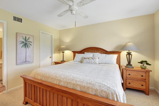 bedroom with ceiling fan and light colored carpet