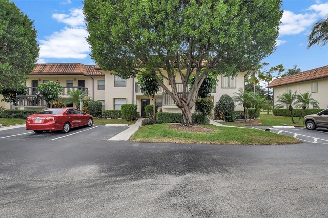 view of property with uncovered parking