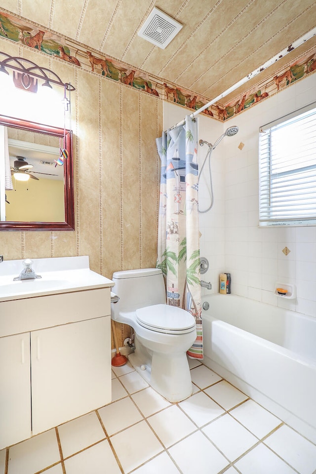 full bathroom with shower / bath combination with curtain, vanity, toilet, and tile floors