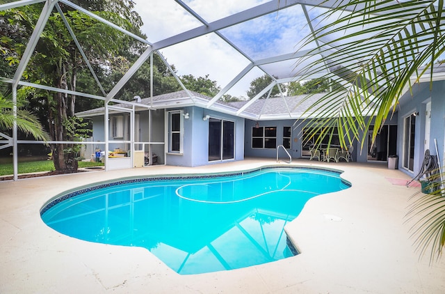 view of pool featuring a patio and a lanai