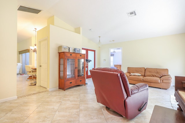 living room with lofted ceiling, light tile flooring, and an inviting chandelier