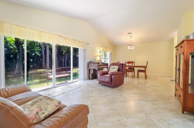 tiled living room featuring lofted ceiling