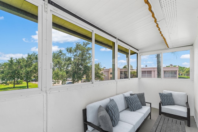 sunroom / solarium featuring lofted ceiling