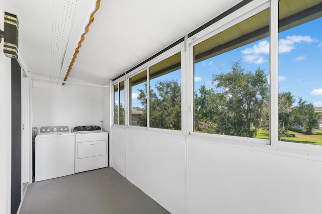 washroom featuring washer and clothes dryer and a healthy amount of sunlight