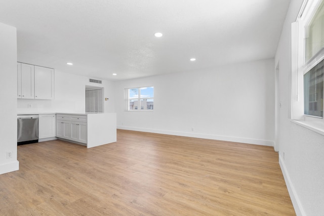 unfurnished living room with light hardwood / wood-style floors